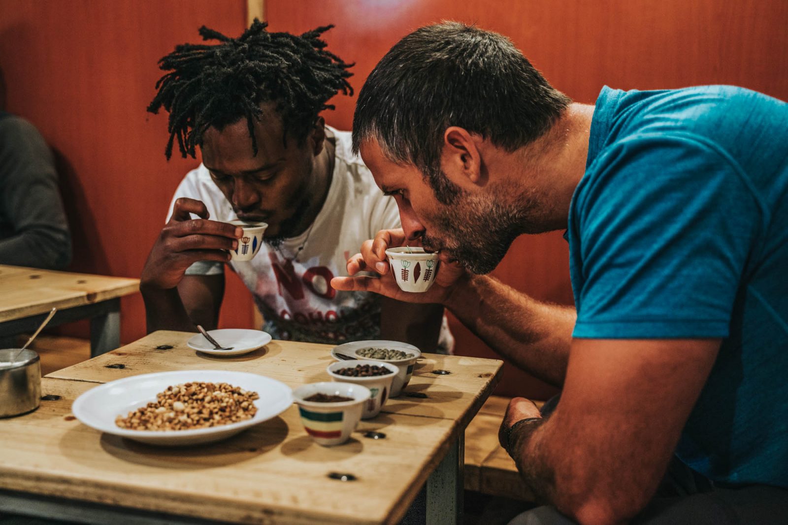 Our Go Addis Tours guide teaching Max the art of drinking coffee in Addis Ababa