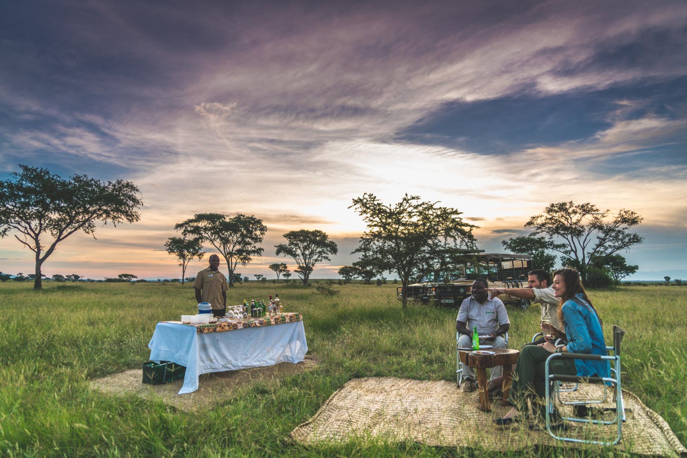 Sundowner on a safari with Ishasha Wilderness Camp in Queen Elizabeth National Park