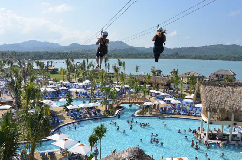 Ziplining in Amber Cove, Dominican Republic. Photo via Fathom Travel