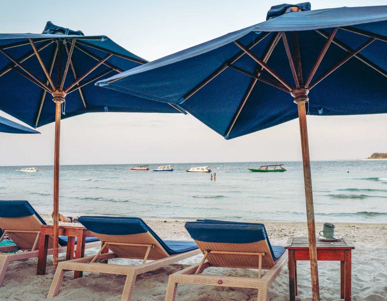 Lounge chairs on the beach in front of Villa Almarik