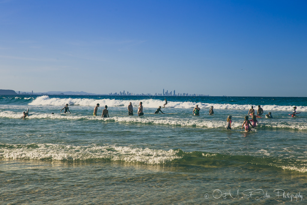 Sydney to Brisbane road trip: Families on the beach in Coolangatta, Gold Coast, QLD