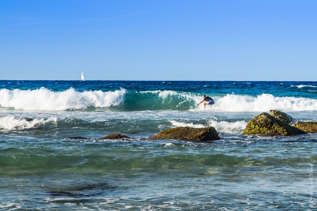 A surfer riding a wave at Coolangatta Beach, Gold Coast, Australia