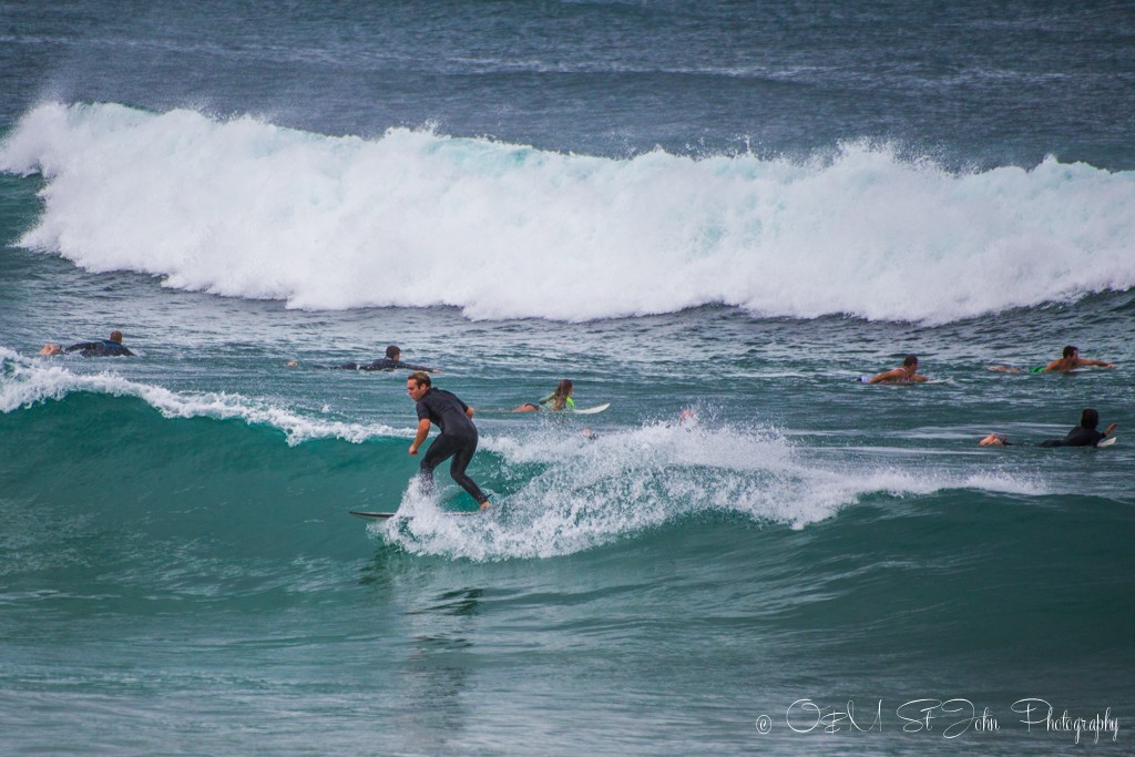 Trip to Australia cost: Surfers on Towns Beach, Port Macquarie, NSW