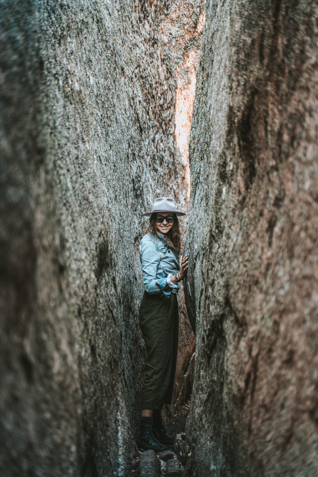 Squeezing through some boulders at Donnelly's Castle