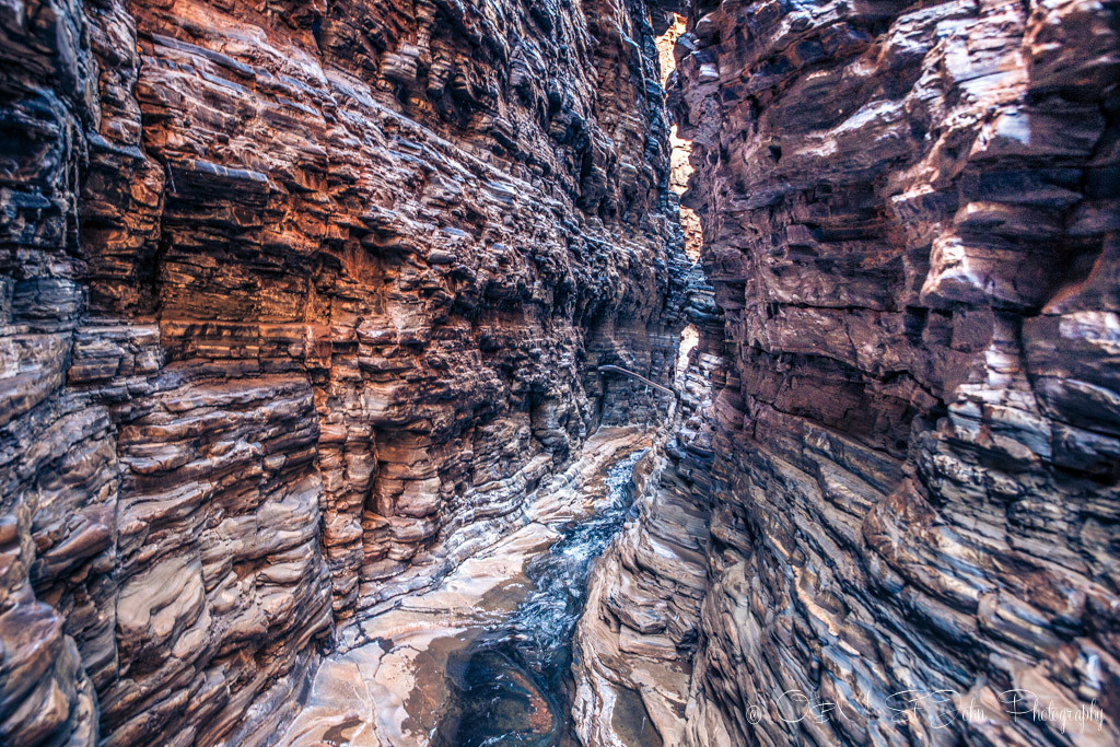 As you reach the Handrail Pool, the passage gets a lot more narrow. Karijini National Park. Western Australia