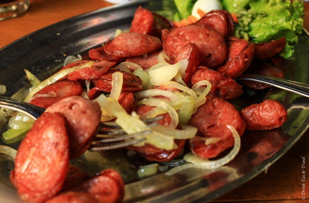 Brazilian dishes: Linguiça calabresa fried with onions