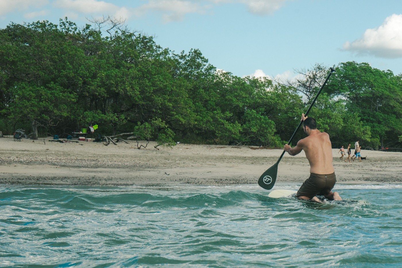 Max paddle boarding in Playa Lagartillo, Costa Rica