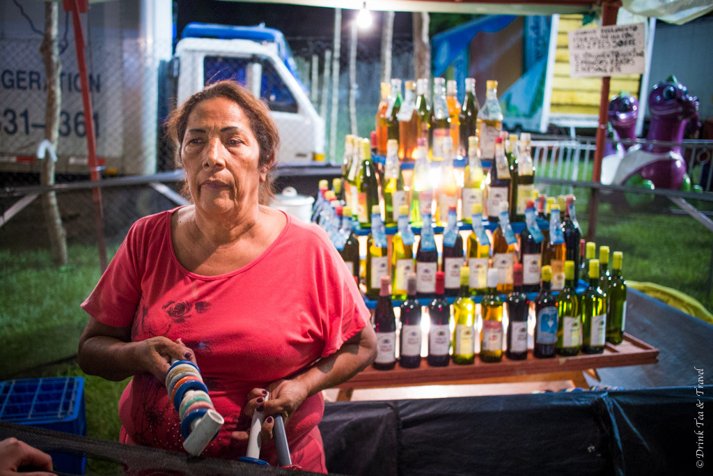 Luck wasn't always on our side. Woman at the local version of the ring toss game. Costa Rica, Fiesta