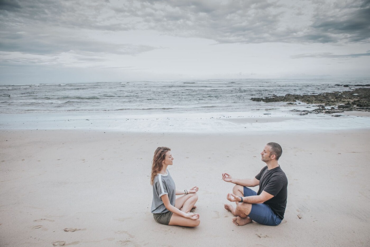 Oksana and Max, meditating on the beach. 