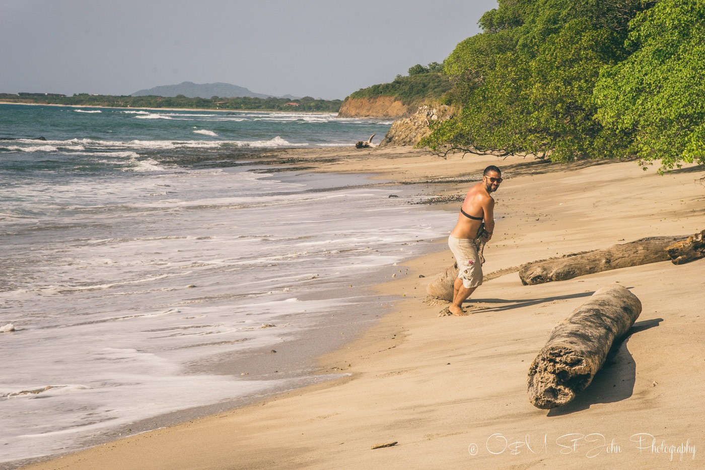 Max hauling driftwood from the beach. Wedding prep. Lagartillo, Costa Rica