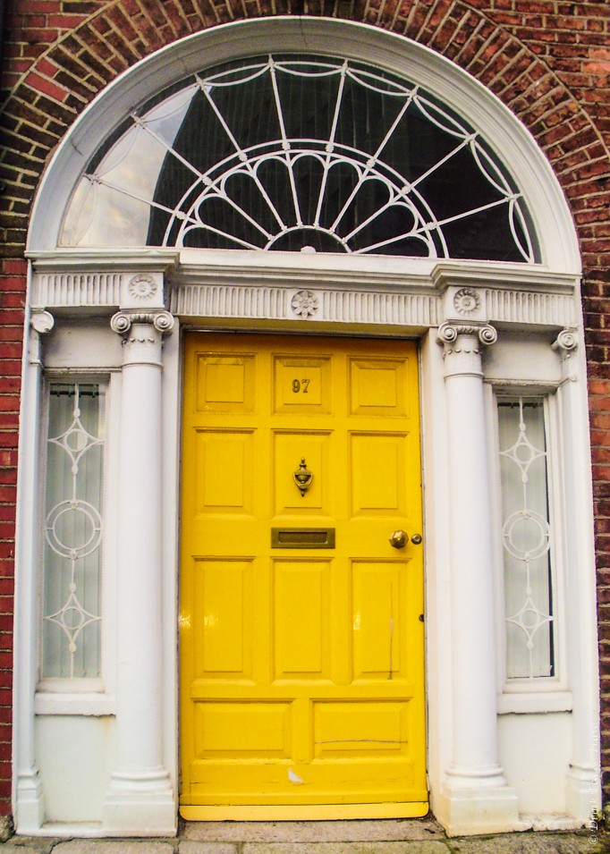 Yellow Georgian style door in Dublin