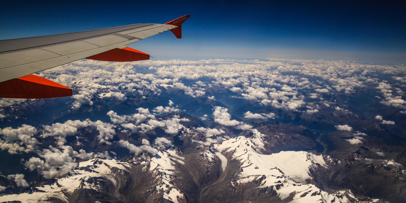 Flight over Swiss Alps. Europe . How to find cheap flights.