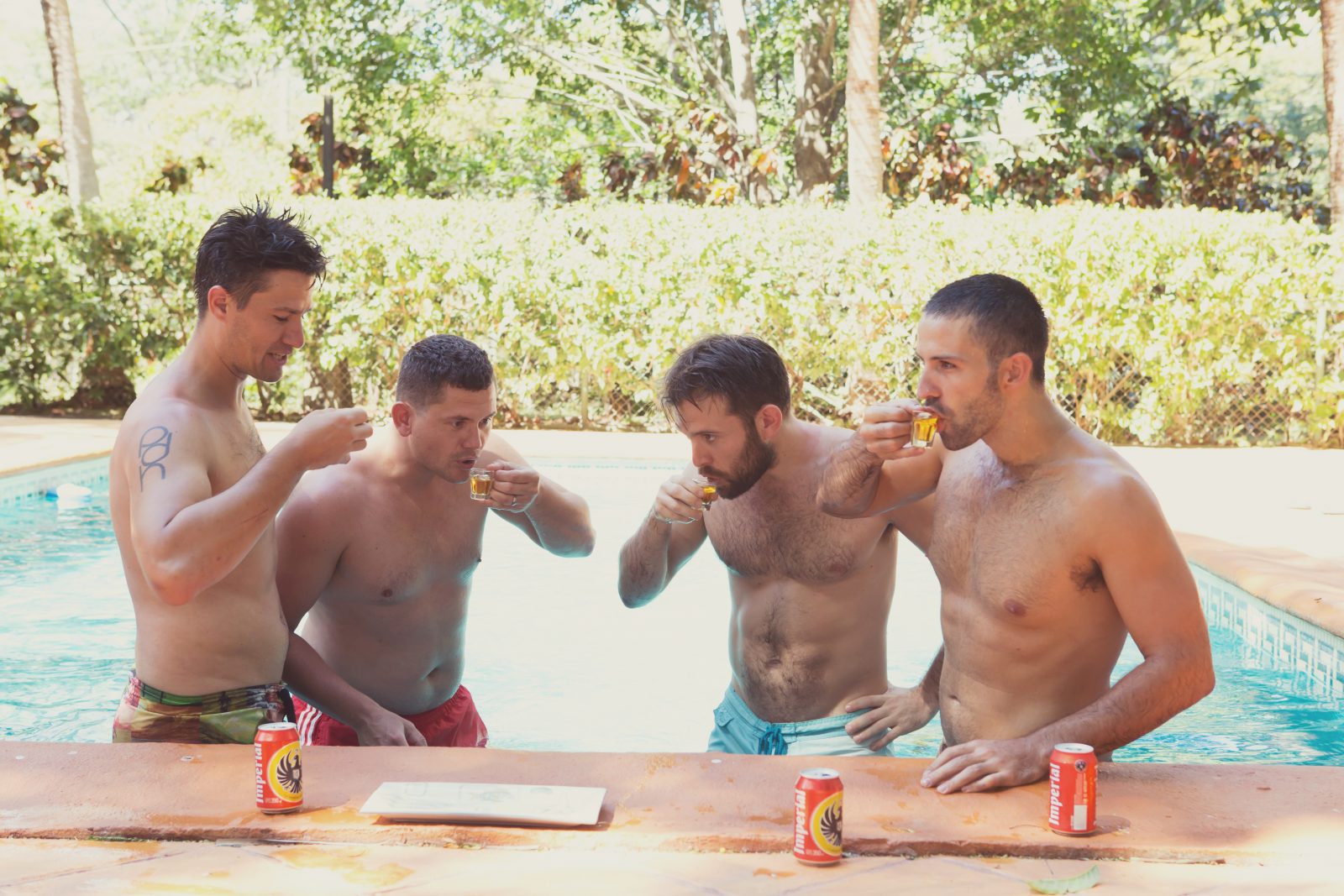 Max and his groomsmen taking shots in the pool. Wedding. Costa Rica