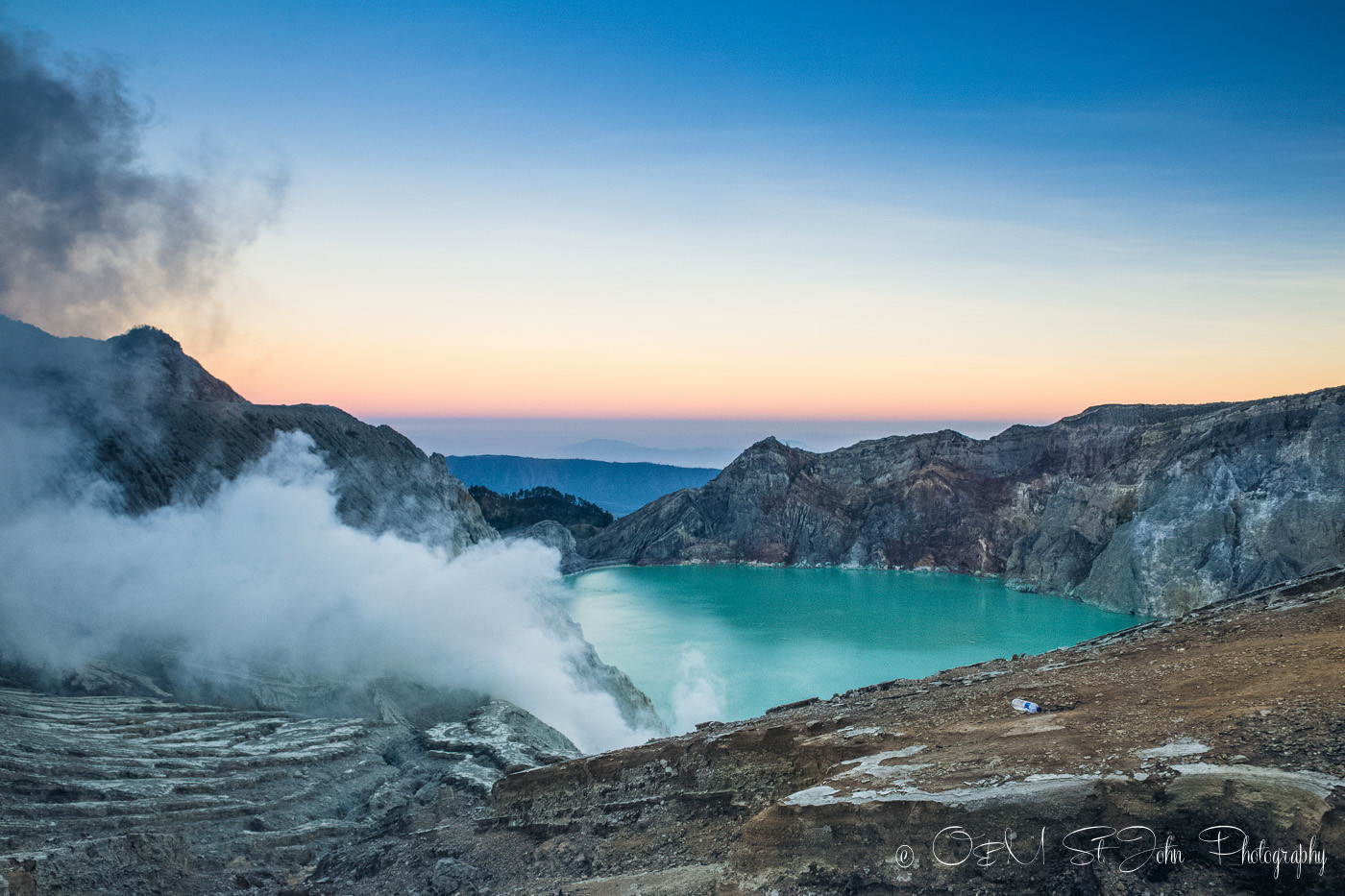 Turquoise sulfur lake of Ijen Crater. East Java, Indonesia