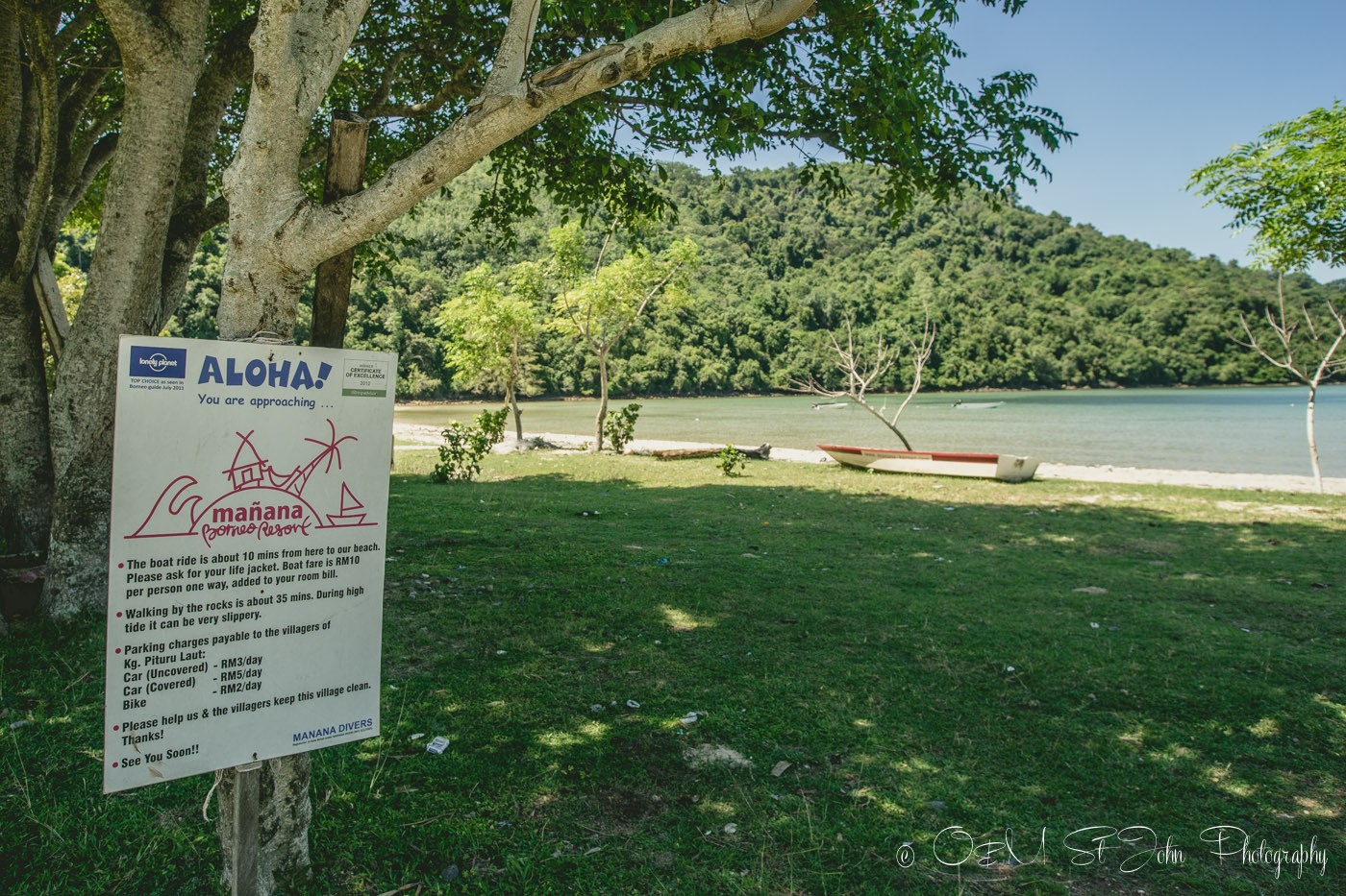 A small sign in Kampung Pituru Laut indicating a pick up point for Mañana Borneo Resort. Sabah. Malaysia