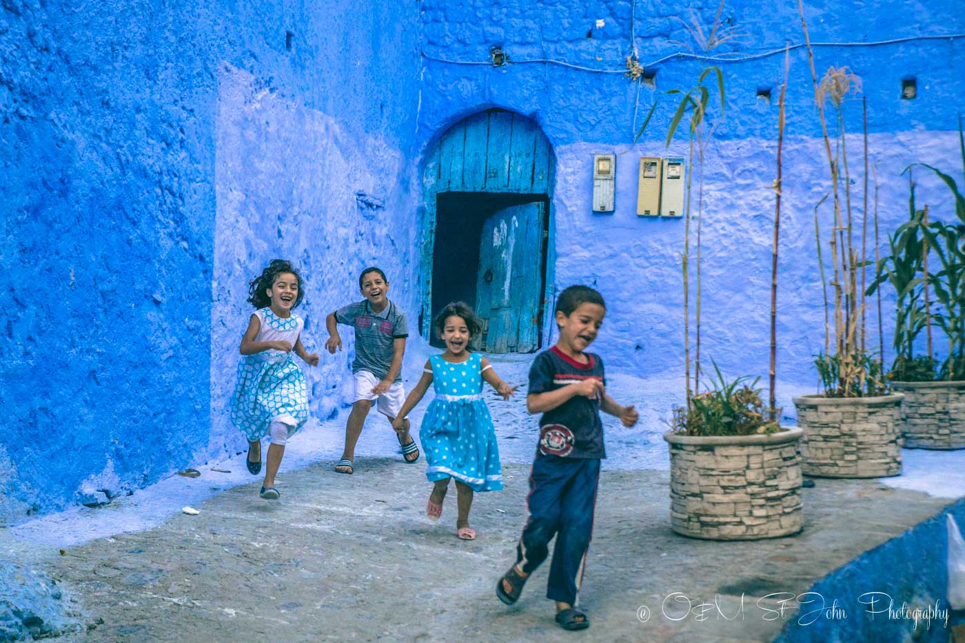 Kids running in Chefchaouen, Morocco