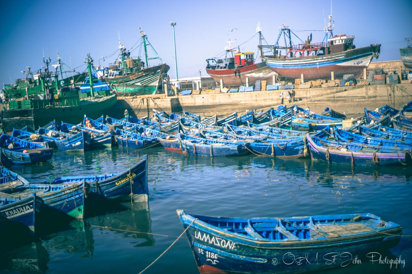 Blue boats lined up in the harbour. Essaouira. Morocco