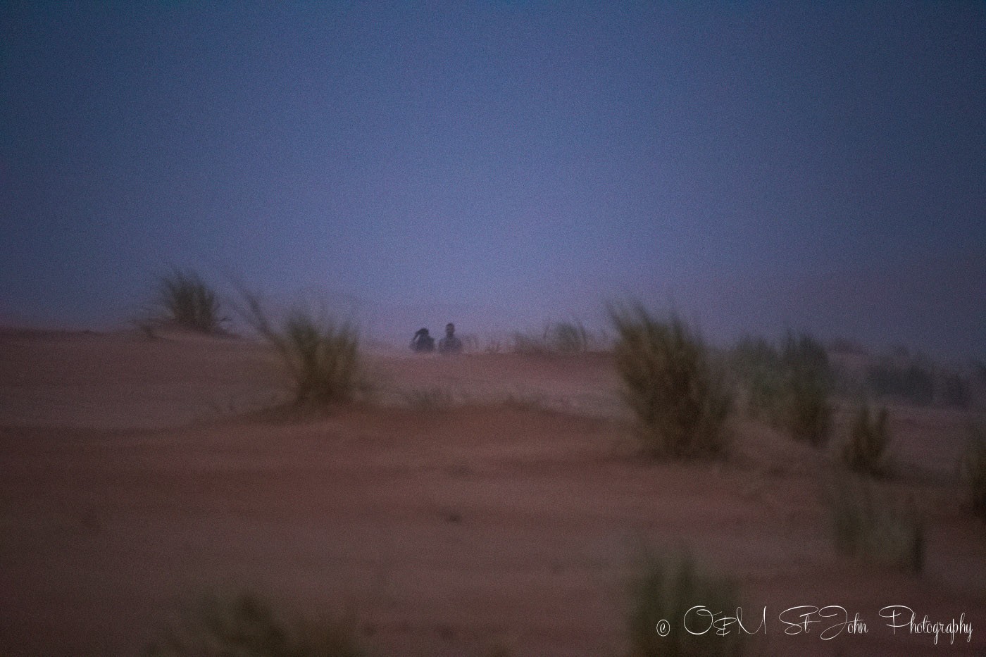 Max and Muhamed in the sandstorm, Erg Chebbi, Sahara Desert. Morocco