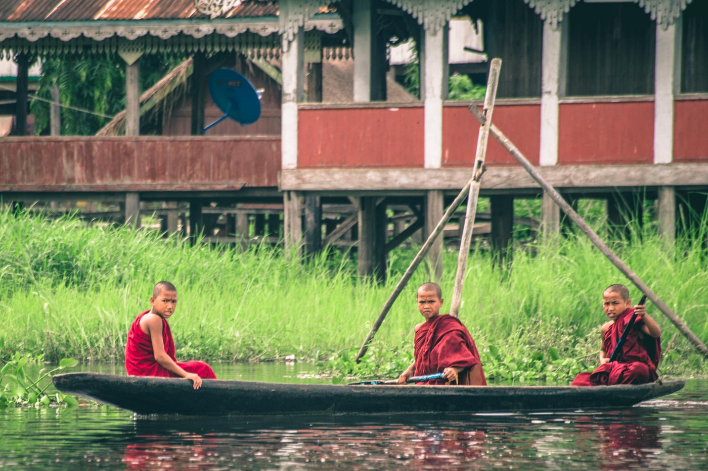 Young Burmese monks making their way across Inle Lake, Myanmar