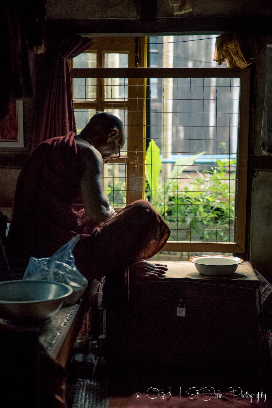 3 days in Yangon: Monk studying in his living quarters at a monastery in Yangon, Myanmar