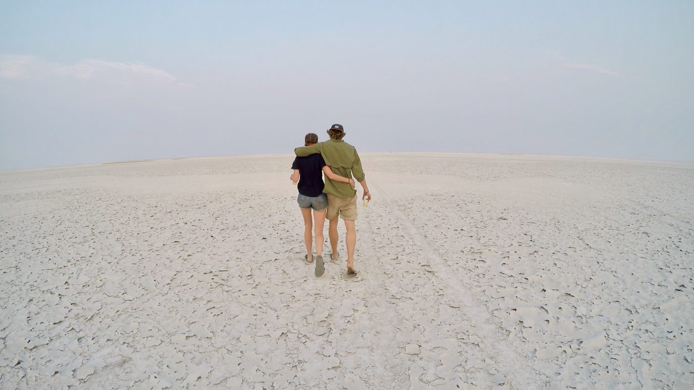 healthy relationship on the road: couple walking on the beach
